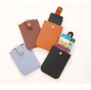Detailed view of various multi-color PU leather pull-out card holders with snap closure