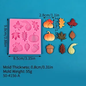 Close-up of autumn silicone mold showing dimensions and finished pumpkin leaf shapes.