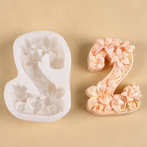 Detail view of a number 2 silicone mold with intricate floral embossed patterns.