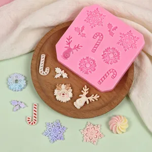 Macro view of Christmas silicone mold with finished snowflake and reindeer crafts