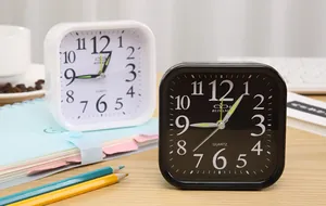 Minimalist square analog alarm clocks in black and white finishes for bedside