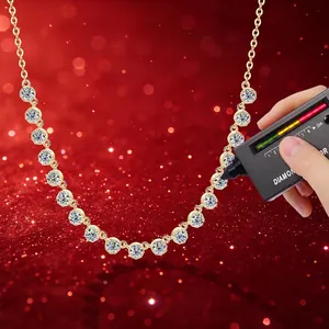 Elegant moissanite bubble necklace with 14k gold filling on sparkling red backdrop