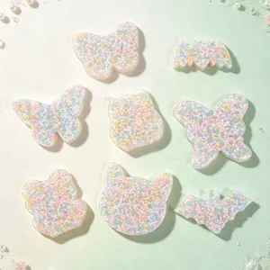 Close-up of pastel silicone skin picking fidget toys in butterfly and bat shapes