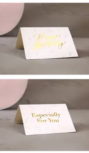 Close-up detail of elegant gold-stamped Happy Birthday and Especially For You greeting cards
