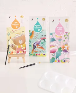 Detailed view of three DIY watercolor painting bookmark sets including brushes and paint