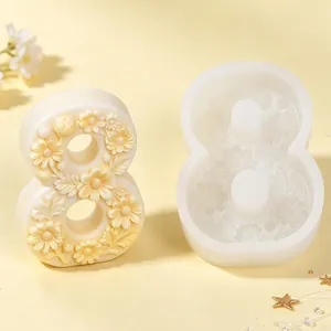 Macro view of number 8 flower relief silicone mold with a finished plaster candle