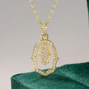 Detailed macro view of the Hamsa Hand pendant necklace with sparkling pavé stones.