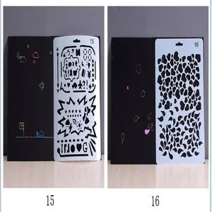 Detail showing two different hollow scratch art stencils with heart and pattern designs.