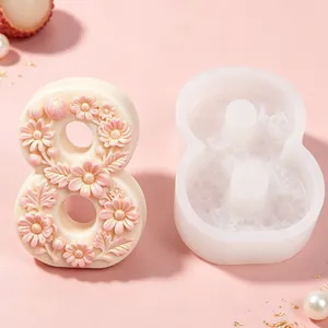 Close-up detail of number 8 silicone mold with intricate floral relief and finished candle