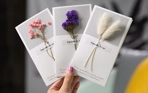 Handmade greeting cards featuring real dried flowers like baby's breath and bunny tails