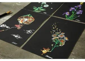 Detailed view of colorful scratch art postcards with floral and creative patterns
