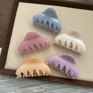 Set of five medium triangle hair claw clips in elegant pastel macaron colors.