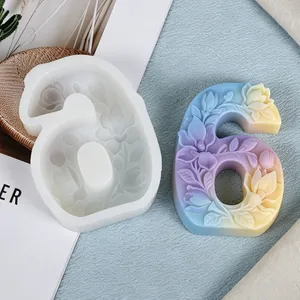 Detail view of a floral relief number 6 silicone mold with a colorful wax sample