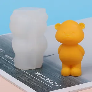 Detailed macro view showing a translucent silicone mold and a cute yellow bear candle