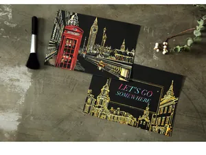 Detail of scratch art postcards featuring London night scene and Let's Go Somewhere text