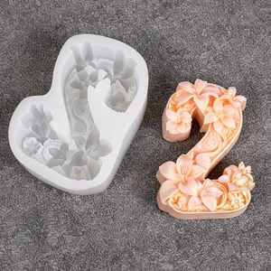 Floral relief number 2 silicone mold for DIY candles and soaps with pink wax sample