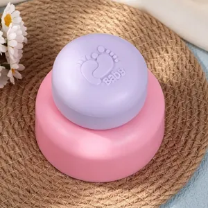 Close-up of circular baby footprint silicone mold for handmade soap and aromatherapy candles