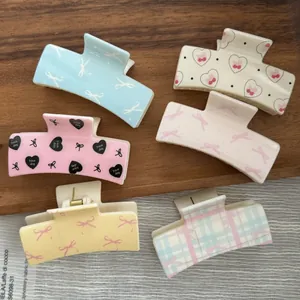Set of sweet macaron square hair claw clips with heart and ribbon UV patterns for women