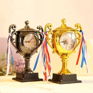 Creative trophy-shaped bedside alarm clock for kids and students as birthday gift.