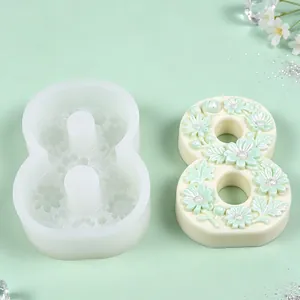 Close-up detail of a floral number 8 silicone mold with a finished 3D plaster ornament