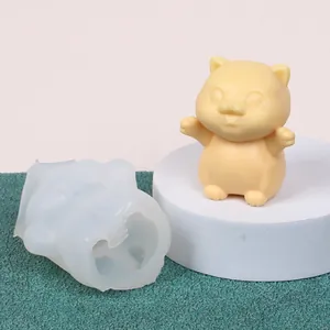 Detailed view of DIY silicone mold and finished cute cat-shaped candle ornament