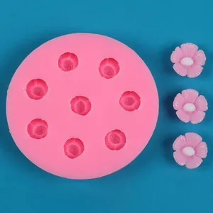 Detailed view of pink cherry blossom silicone mold and finished flower resin samples