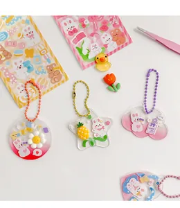 Detailed view of DIY Guka acrylic keychain set with cute rabbit stickers and colorful charms
