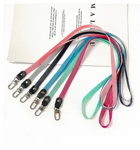 Close-up detail of colorful minimalist neck lanyards with metal clips for ID badges