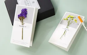Handmade greeting cards featuring real dried flowers in an elegant minimalist design
