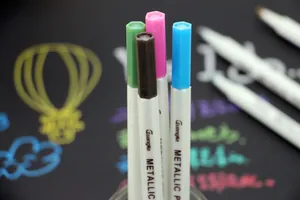 Close-up of colorful metallic pens used for DIY photo album and graffiti decoration