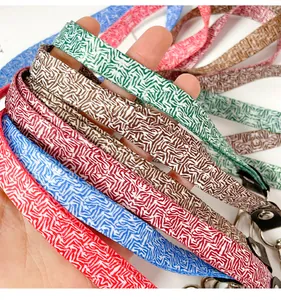 Close-up of colorful geometric patterned lanyards with durable metal clips for ID badges