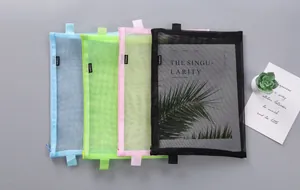 Detailed view of four colorful mesh A4 file bags showing their unique material transparency