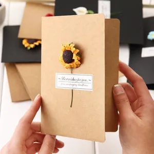 Creative vintage kraft paper greeting card with a handmade dried sunflower detail