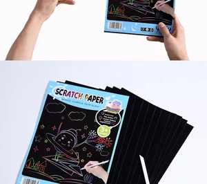 Macro detail of kids scratch paper art set with creative rainbow patterns and stylus.