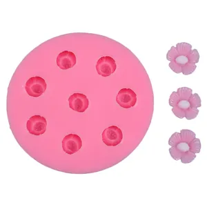 Detailed view of pink cherry blossom silicone mold with finished DIY resin flowers