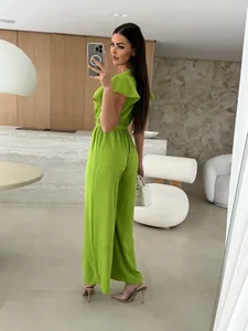 Stylish lime green V-neck jumpsuit with elegant flutter sleeves and waist tie detail.