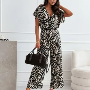 Eleganter Sommer-Jumpsuit mit Zebramuster, V-Ausschnitt und weitem Bein für Damen.