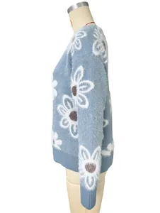 Soft fuzzy blue knitted cardigan with large white flower pattern on mannequin side profile