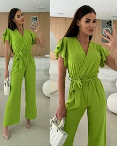 Detailed view of the lime green V-neck jumpsuit with ruffle sleeves and belted waist