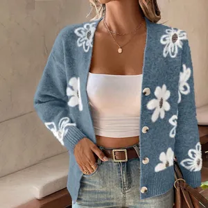 Detail of blue floral knit cardigan with soft mink velvet texture and loose fit.