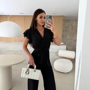Elegant black V-neck jumpsuit with ruffle sleeves and waist tie, perfect for summer wear