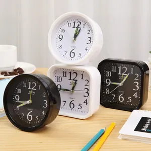 Modern minimalist black and white bedside alarm clocks in round and square styles.