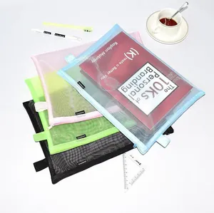 Detailed view of layered multi-colored semi-transparent mesh document bags with zippers