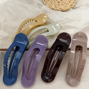 Set von 6 großen geschwungenen Jelly-Haarspangen aus PC in verschiedenen Farben.