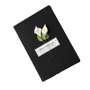 Handmade dried flower greeting card with white calla lilies on black cardstock