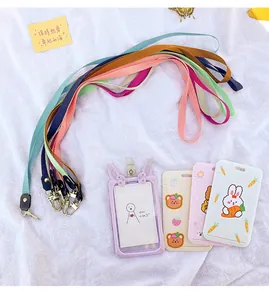 Detailed view showing various colorful lanyards with cute cartoon pattern card holders