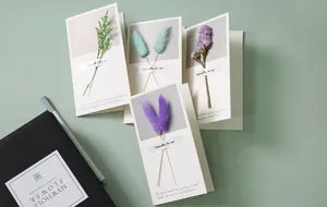 Collection of handmade greeting cards featuring various real dried flowers