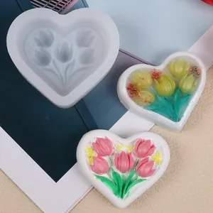 Heart-shaped tulip silicone mold shown with colorful finished soap creations.