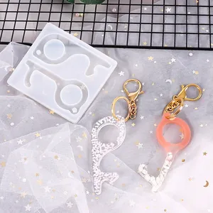 Detailed view of DIY silicone mold and finished non-contact resin keychains on star mesh