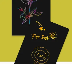 Close-up of rainbow scratch art paper showing colorful flower and golden lion